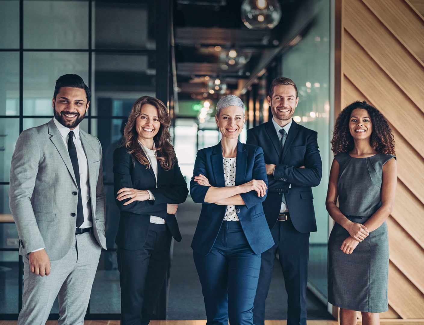 Five business people facing the camera