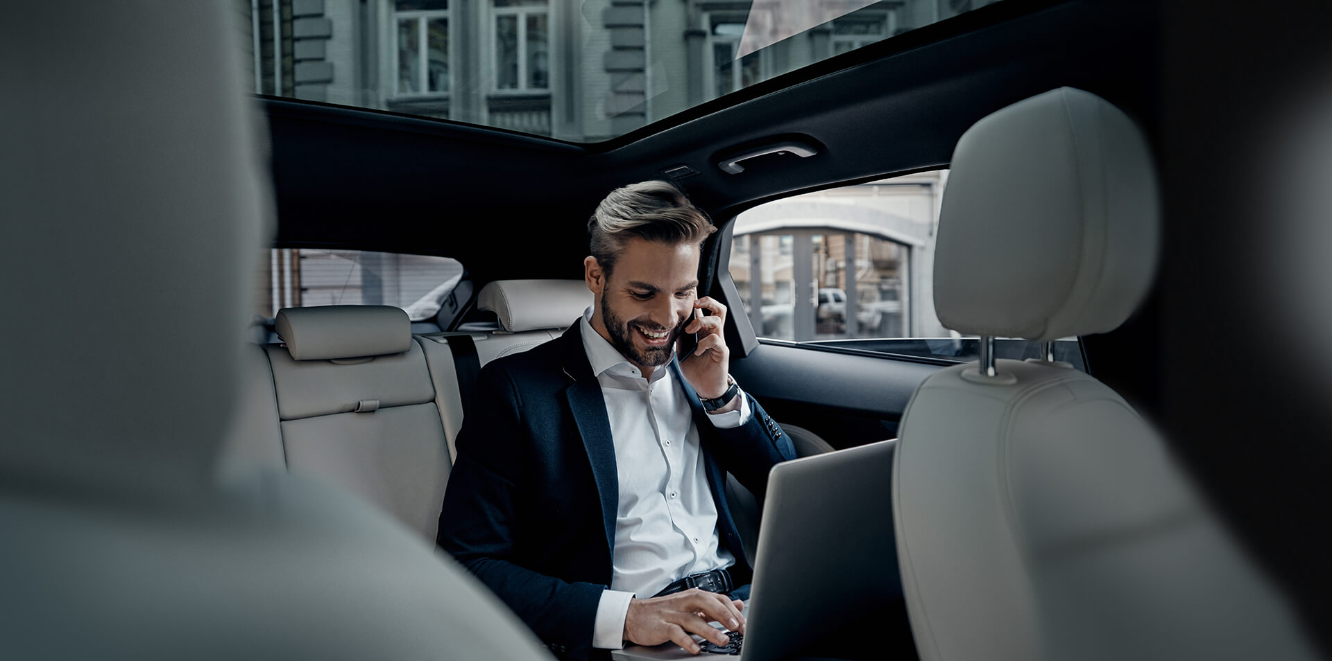 Man talking on the phone in a car